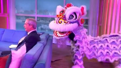 Nigel Farage has awkward encounter with Chinese Dragon live on This Morning