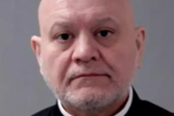 Priest accused of using teen girl's hair as floss as they waited in line to see a relic