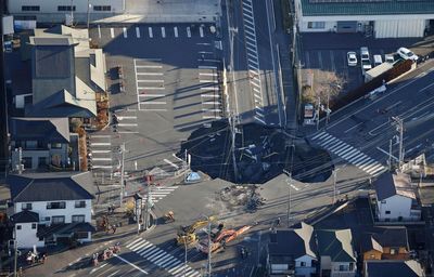 Japan tries to rescue man stuck in sinkhole. Here's what's going on.