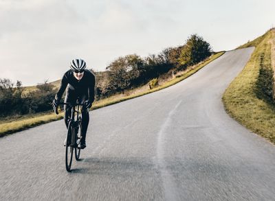 How do I deal with a headwind on a round biking loop?
