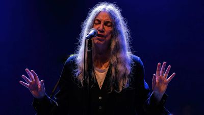 Patti Smith collapses on stage during a show in Brazil, before completing gig from a wheelchair