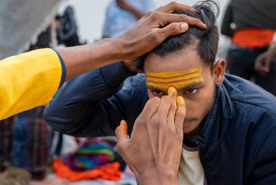 Sacred strokes of color on foreheads are a major display of Hinduism at India’s Maha Kumbh festival