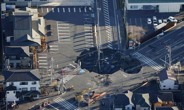 Fears grow in Japan for truck driver trapped in sinkhole for third day