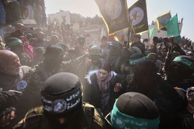 AP photos capture a day of wrenching emotion as Israel and Hamas release hostages and prisoners