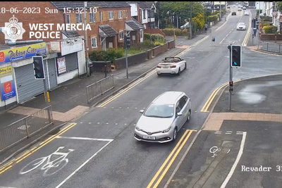 Moment BMW driver smashes into man who flips and lands in backseat of convertible