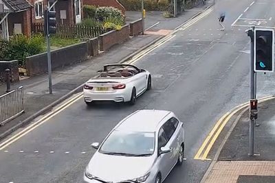 Moment BMW driver smashes friend's car into pedestrian sending him catapulting into backseat