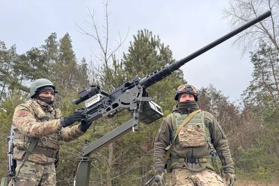 The defenders of Kyiv using World War Two-style machine guns on farm trailers