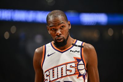 Watch Kevin Durant and other NBA stars react to the Luka Doncic trade stunner while on the bench