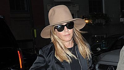 Jennifer Aniston found two easy ways to elevate jeans – a satin bomber and fedora hat gives denim an instant lift