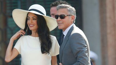 We're captivated by Amal Clooney's exquisite ivory and contrasting navy trim suit – it's a timeless wardrobe must-have