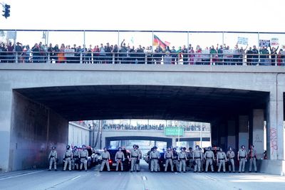 Marchers protesting planned deportations block major freeway in Los Angeles