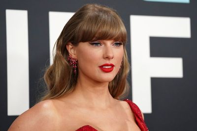 Taylor Swift sparks speculation in all-red ensemble at Grammys