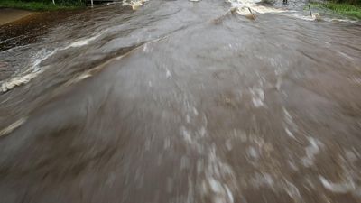 Men's bodies swept kilometres by deadly floodwaters