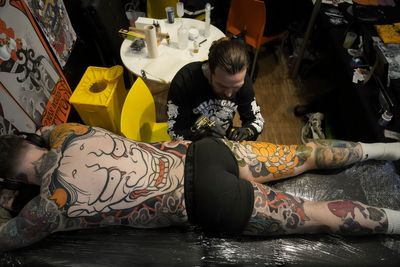 AP PHOTOS: Vivid, shocking or thought-provoking tattoos are showcased in Paris