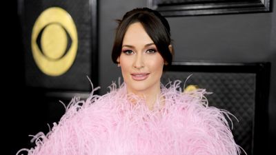 Kacey Musgraves's traditonal coffee table decor is the perfect finishing touch to her color-drenched sitting corner – it's just the right amount of whimsy