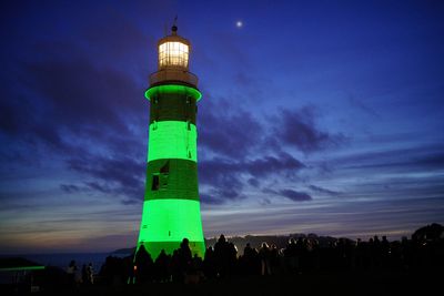 Plymouth lighthouse lit up green in memory of university lecturer