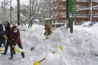 Record-breaking snow causes major travel disruption in Japan