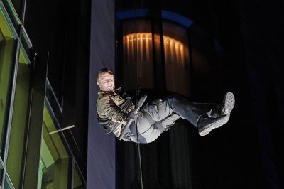 Bear Grylls scales 120ft central London building to promote new Netflix show