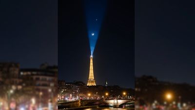 Venus and the moon dance over the Eiffel Tower in stunning 'planetary parade' photo from Paris