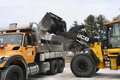 Storms flood neighborhoods with a wintry mix and drop 'thunder ice' in several states