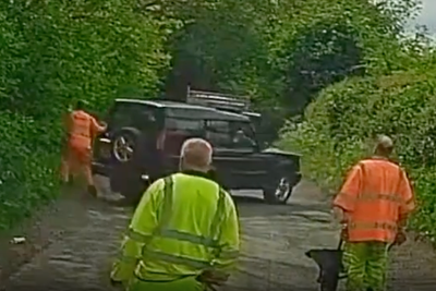 Land Rover driver knocks pothole worker into bush after ignoring road closure