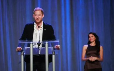 Prince Harry and Meghan Markle share public kiss at Invictus Games opening