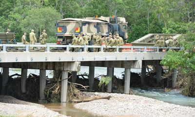 Towns cut off by Queensland floods warned against panic-buying as premier vows ‘resilient’ rebuild