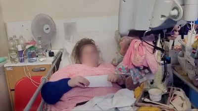 Woman living in hospital bed for 18 months is arrested and evicted after NHS took legal action against her