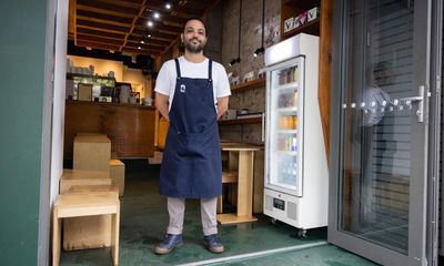 Sydney cafe’s furniture floats down the street as downpour soaks the city