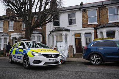 Woman found dead after man seen trying to break into flat