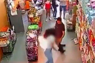 Shocking moment woman’s phone bursts into flames in her pocket at supermarket in Brazil