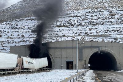 Two dead and multiple injured in Wyoming tunnel collision as police warn of ‘explosion threat’