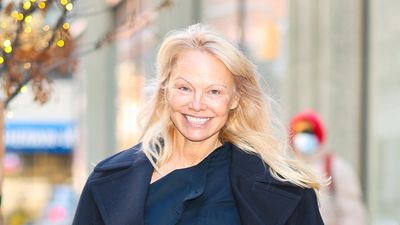 Pamela Anderson's check print dress is actually the chicest twist on a classic Burberry trench coat