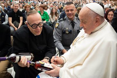 A victory sip for kindness: Bourbon bottles autographed by the pope raise thousands for charity
