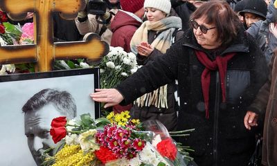 Alexei Navalny supporters visit grave on first anniversary of his death