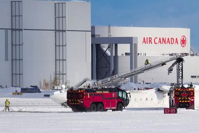 At least 18 injured when Delta Air Lines plane overturns in crash-landing at Toronto airport