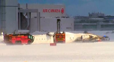 Delta Airlines flight flips over on landing at Toronto's Pearson Airport and 8 people are hurt