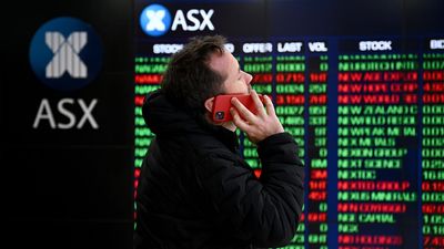 Aussie shares extend losses after RBA cuts rates