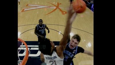 Virginia's Anthony Robinson Blocks Duke's Cooper Flagg at the Rim in Dominant Play