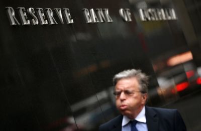 Australian central bank cuts benchmark interest rate for the first time since October 2020