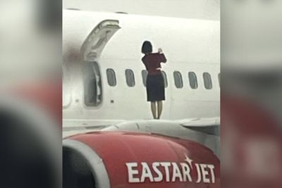 Backlash after flight attendants caught taking photos on plane wing