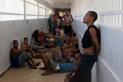 Dominican officials cram thousands of inmates facing no charges into overcrowded prisons