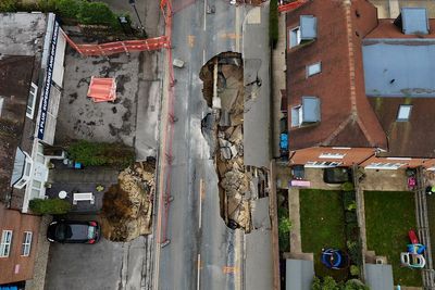 Investigations continue after sinkhole shuts Surrey street