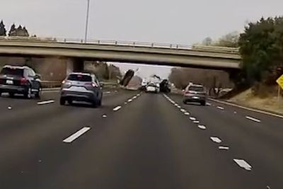 Car flies off overpass, crashes onto California freeway