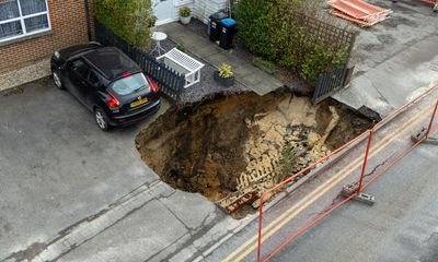 What are sinkholes, how are they formed and why did one appear in a Surrey street?