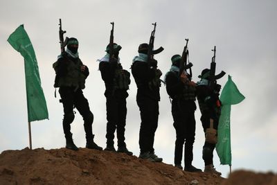 Hamas Hands Over Dead Israeli Hostages In Black Coffins