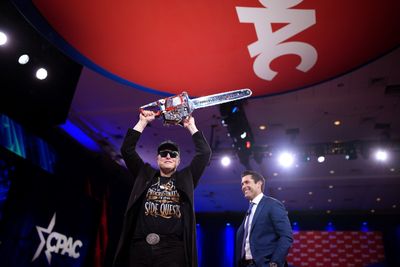 Musk waves gifted chainsaw at CPAC