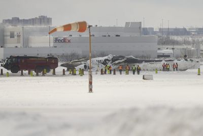 Delta is offering $30,000 with 'no strings attached' to passengers on the Toronto flight that crash-landed. Legal experts say they should read the fine print