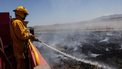 Warnings downgraded but out-of-control blazes continue