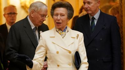 Princess Anne is classic in white and gold skirt suit that oozes the elegance of a Chanel ensemble